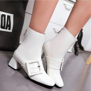 white patent leather buckle boots